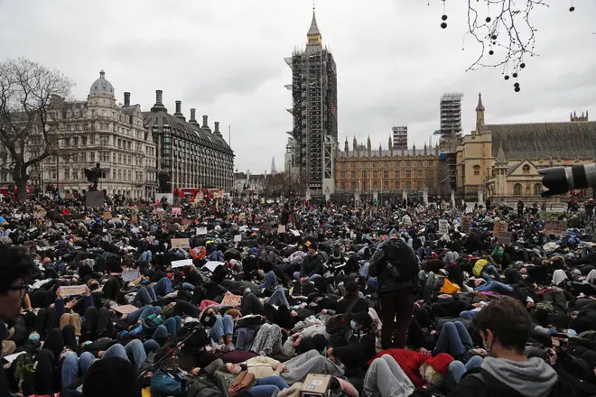 Thousands of protesters lay-down outside Parliament in memory of Sarah Everard.