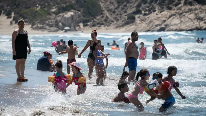 Tourists on Patara beach in Turkey's Antalya district on the Mediterranean Sea last summer