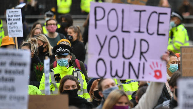Officers looked on as protesters chanted anti-police slogans in Parliament Square
