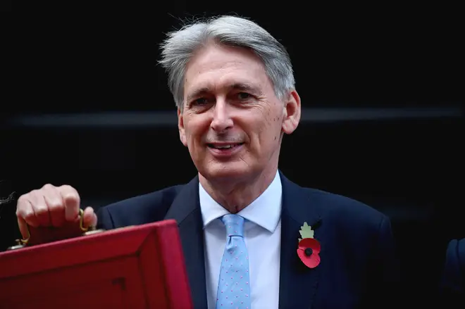 Philip Hammond holds up the Budget Red Box in Downing Street