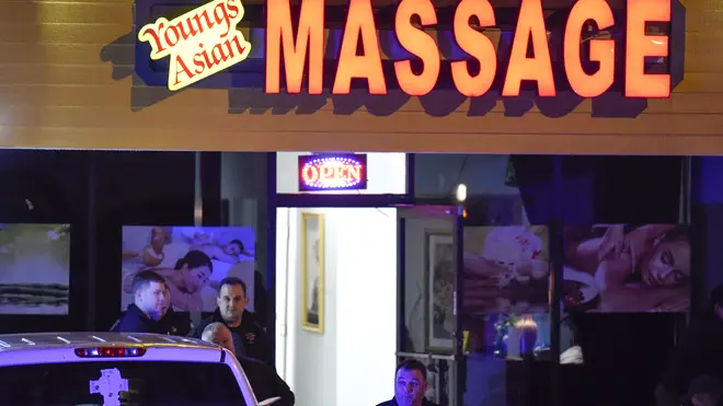 Authorities investigate a fatal shooting at a massage parlo
