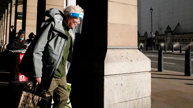 Shielding ends on April 1: Pictured, a man wearing a face shield walks outside Westminster Station in London