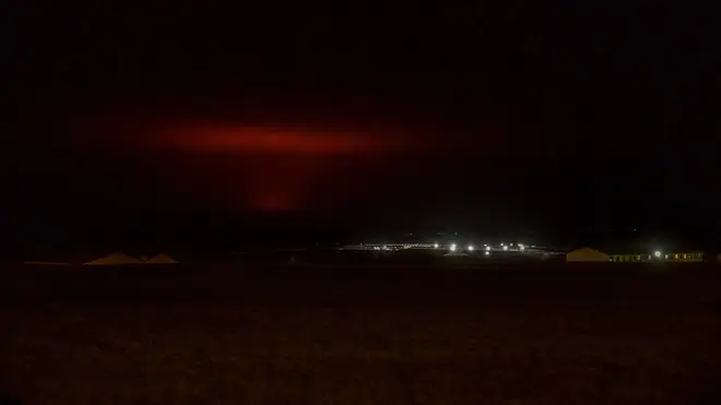 The red shimmer from magma is seen coming out from the erupting Fagradalsfjall volcano
