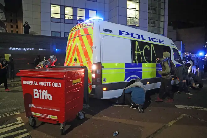 Pictures showed graffiti being sprayed on an Avon and Somerset Police vehicle