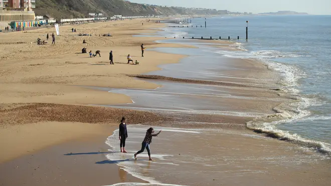 People enjoy the weather at Sandbanks beach, Dorset
