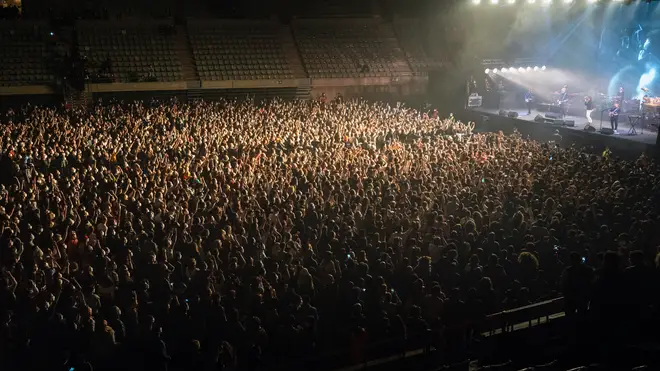 Fans at the concert by rock group Love of Lesbian