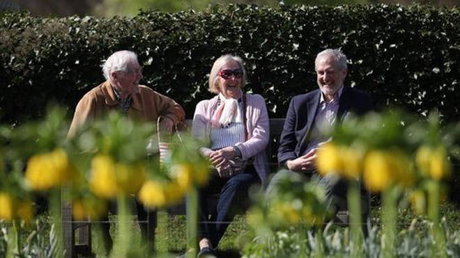 Visitors enjoying the sun at Kew Gardens in south-west London