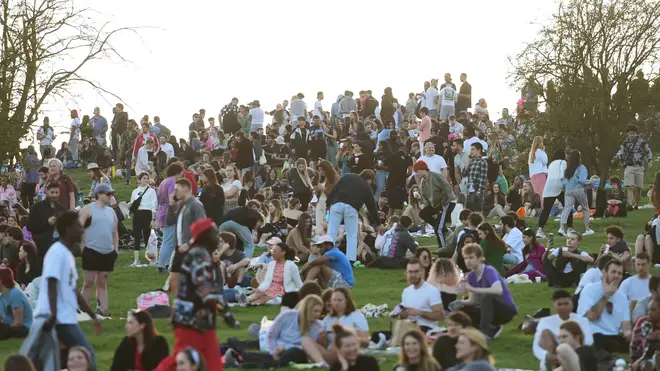 Crowds of people gathered on Primrose Hill in London to enjoy the mini-heatwave on Tuesday, with more high temperatures forecast.