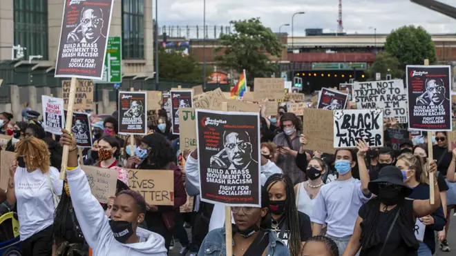 People during a protest march organised by Black Lives Matter from the US Embassy towards Parliament square