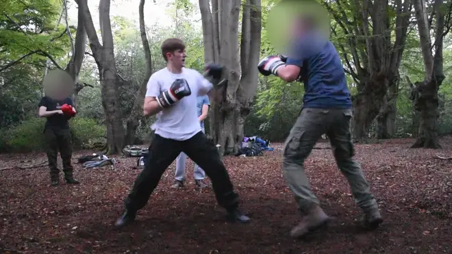 A clip shows Hannam participating in outdoor boxing event.