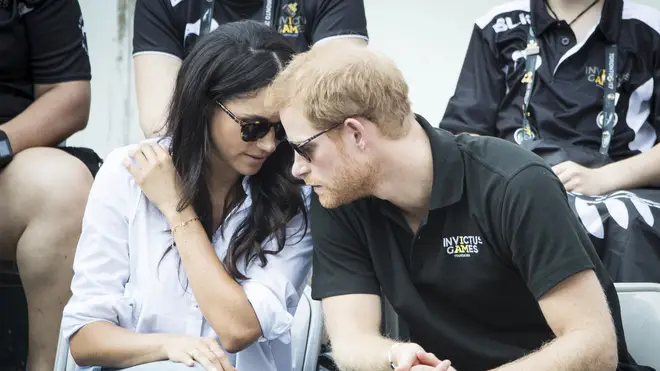 Prince Harry and Meghan Markle talk during the Invictus Games