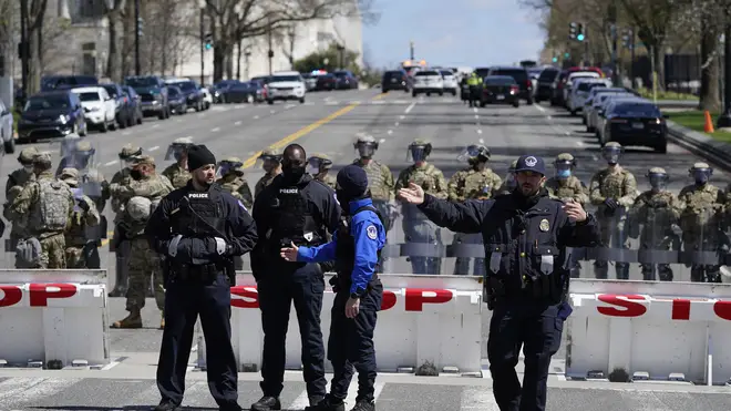 Members of the U.S. Capitol Police stand guard near the scene