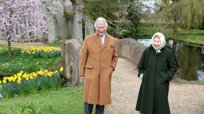 The Queen and Prince Charles were pictured smiling while walking in Windsor ahead of Easter
