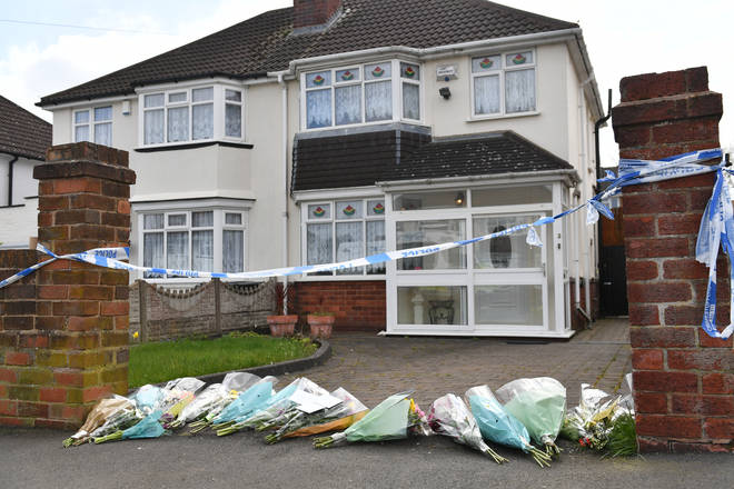 Floral tributes have been left outside Ms Downer's house.