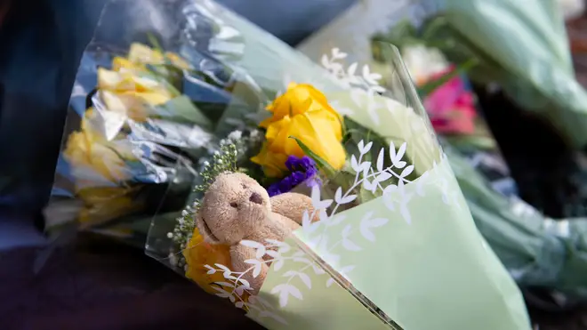 Flowers and soft toys have been laid at the scene of the collision.