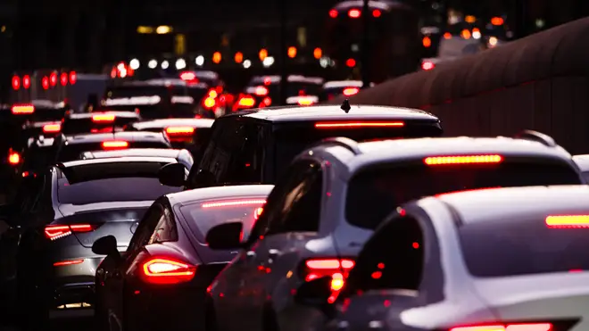 Cars including SUVs queue in a long traffic jam on Knightsbridge in London