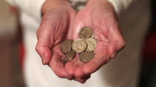 A woman with coins in her hand