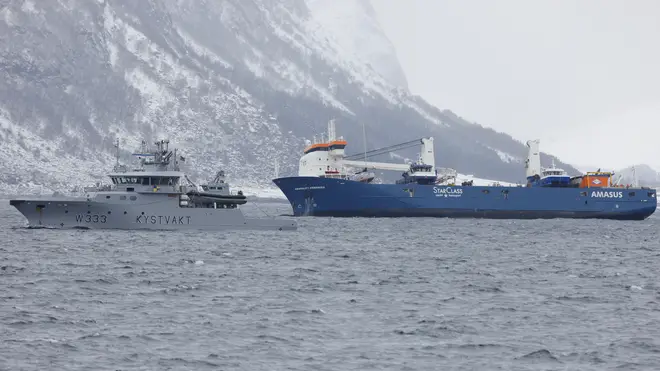 The Dutch cargo ship Eemslift Hendrika is guided to land at Alesund, Norway
