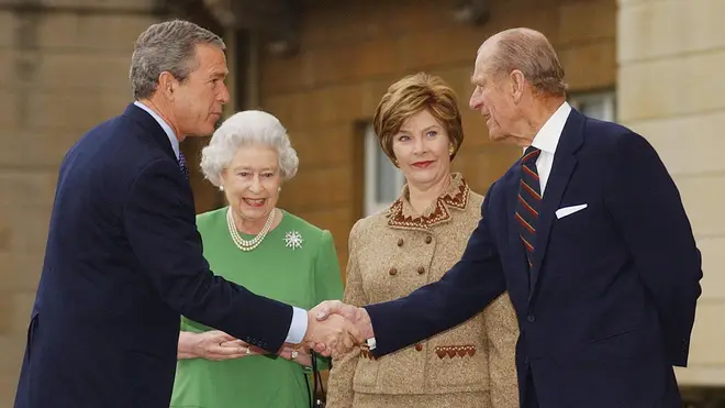 Then US president George Bush shakes hands with the Duke of Edinburgh in 2003