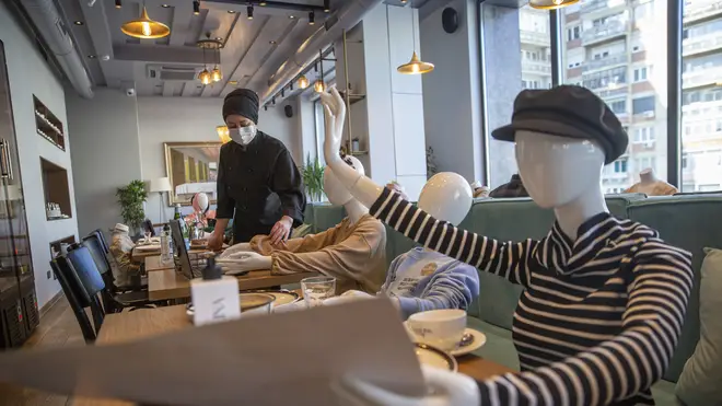 Mannequins are positioned at the tables of Bagolina eatery restaurant, as a protest against the latest government Covid-19 lockdown measures in Kosovo capital Pristina