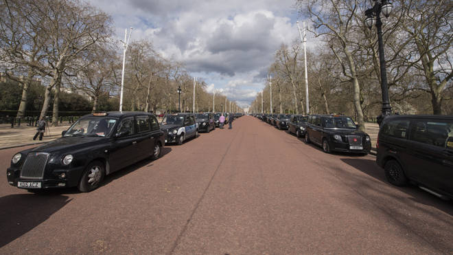 Black taxis lined up along The Mall