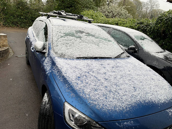 A car is covered with snow in Maidenhead