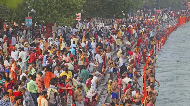 Devotees take holy dips in the River Ganges during Shahi snan or a Royal bath at Kumbh Mela, in Haridwar in the Indian state of Uttarakhand