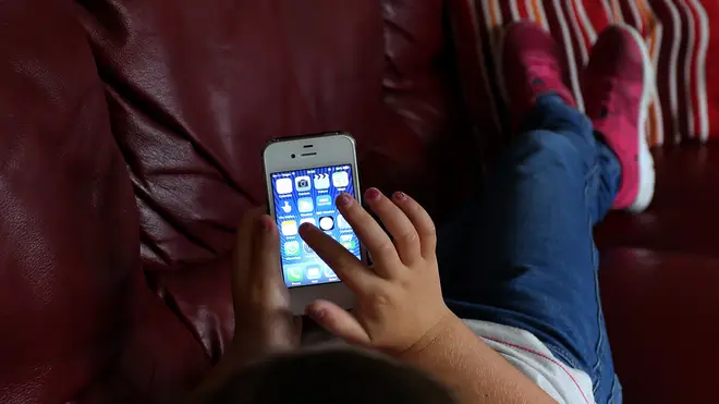 A young person using a smartphone