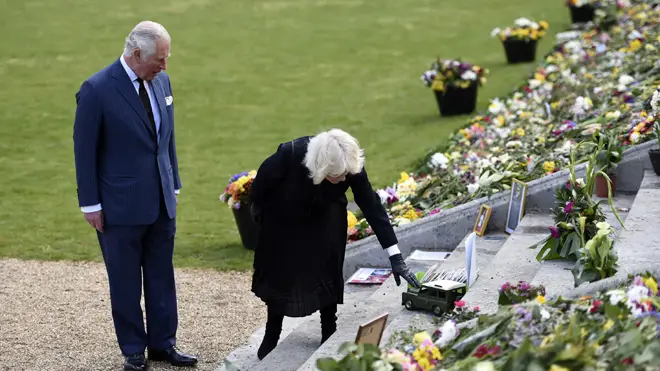 Charles and Camilla viewed the sea of tributes at Marlborough House Gardens