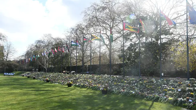 The flowers, tributes and messages left by members of the public outside Buckingham Palace