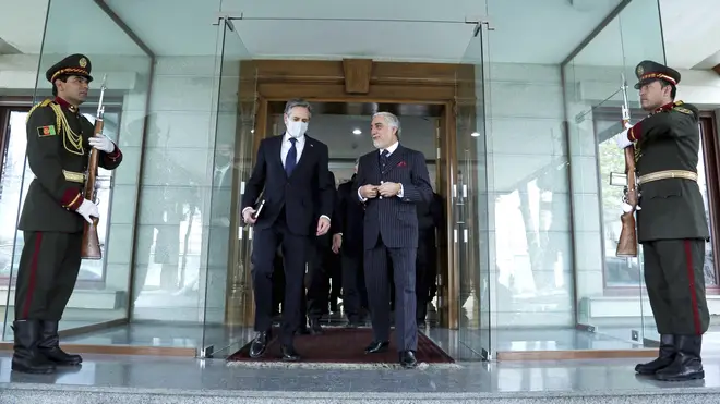 Abdullah Abdullah, Chairman of the High Council for National Reconciliation, walks with US Secretary of State Antony Blinken, at the Sapidar Palace in Kabul