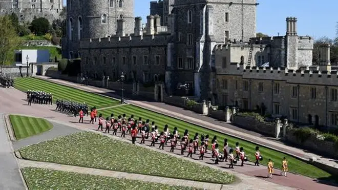 The Foot Guards Band are seen marching outside St George's Chapel