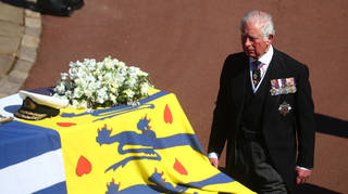 The Prince of Wales pays his respects behind his father's coffin