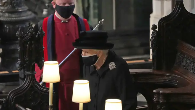 Queen Elizabeth II takes her seat in St George's Chapel, at Windsor Castle, Berkshire, for the funeral of the Duke of Edinburgh.