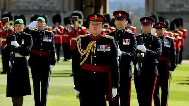 Members of the Military observed a minute's silence ahead of the funeral
