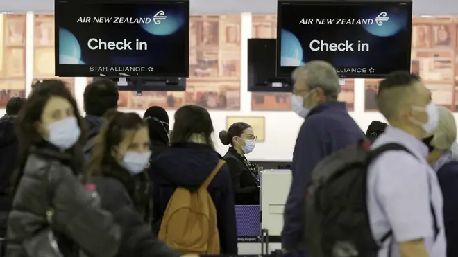 Passengers prepare at Sydney Airport to catch a flight to New Zealand as the much-anticipated travel bubble between Australia and New Zealand opens