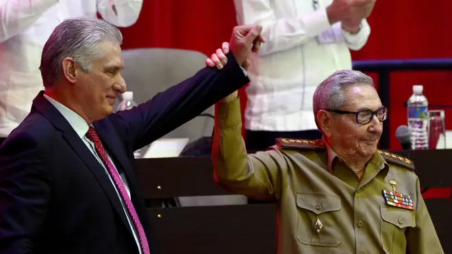 Raul Castro, right, raises the hand of Cuban President Miguel Diaz-Canel after he was elected First Secretary of the Communist Party at the closing session of Cuban Communist Party’s 8th Congress at the Convention Palace in Havana, Cuba