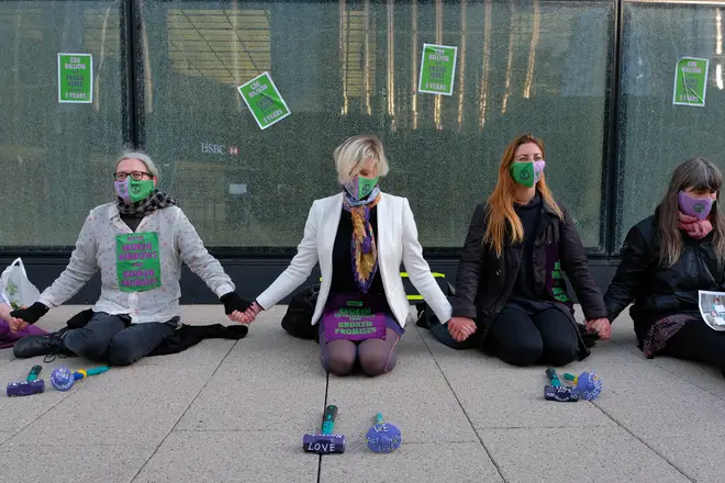 The group sat down outside HSBC&squot;s Canary Wharf headquarters and "waited to be arrested".
