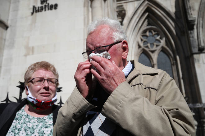 Former post office worker Noel Thomas, who was convicted of false accounting in 2006, celebrates with his daughter Sian outside the Royal Courts of Justice.
