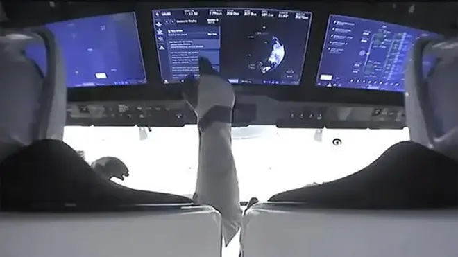 Astronauts in the cockpit of the SpaceX Crew Dragon spacecraft after lift off