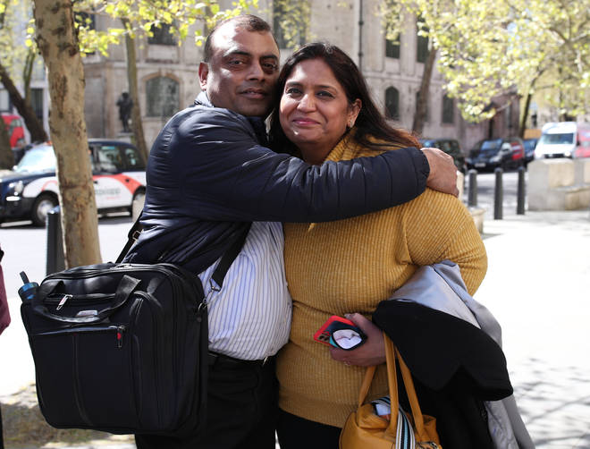 Former post office worker Seema Misra, who was jailed for a conviction of theft in 2010, celebrates with her husband Davinder after the decision.
