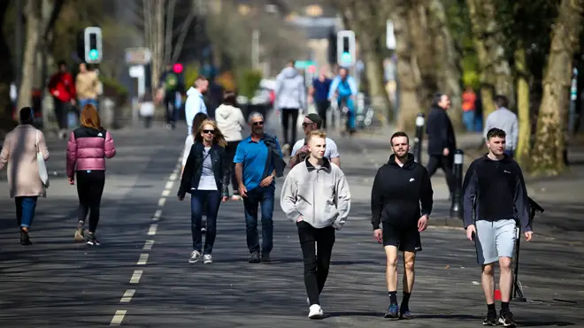 People are seen enjoying the sunny weather in Kelvingrove Park on April 16, 2021 in Glasgow
