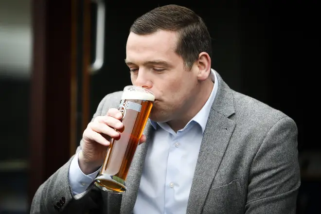 Scottish Conservatives leader Douglas Ross enjoys a pint at an Edinburgh pub