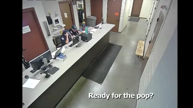 In footage from the station after the arrest, told fellow officers "ready for the pop?" as he showed them his body camera footage