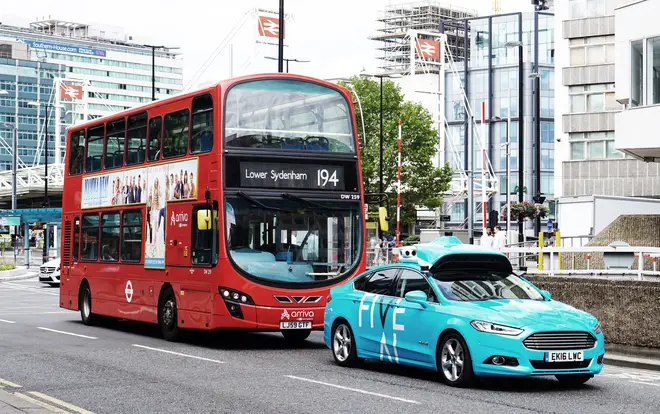 File photo showing a self-driving car in front of a London bus two years ago