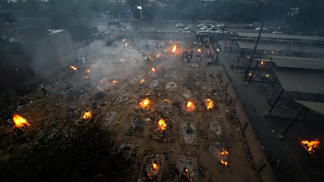 Mass cremation of COVID-19 victims at old Seemapuri crematorium ground in New Delhi