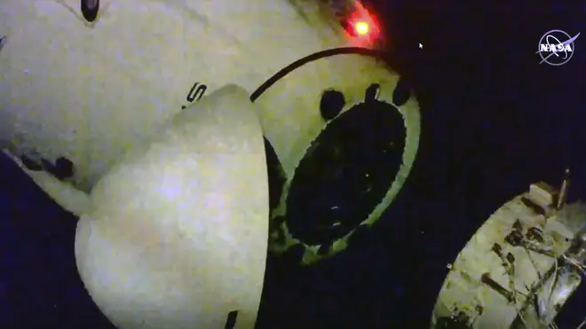 This image from video provided by NASA shows the SpaceX capsule as it departs the International Space Station on Saturday
