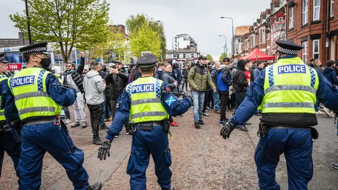 A man has been arrested following clashes with the police outside Old Trafford on Sunday