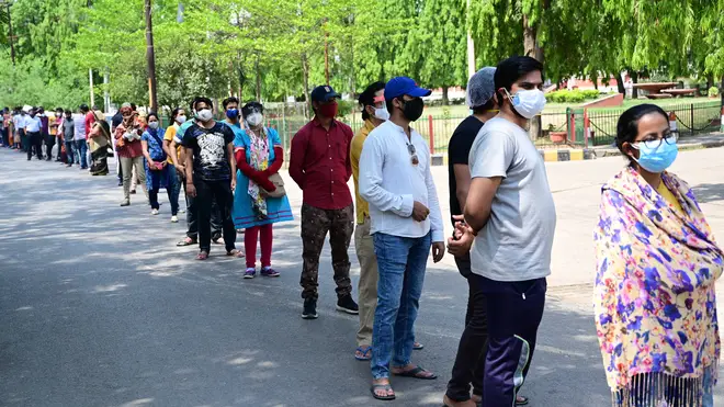 People line up to get the Covid-19 vaccine in Prayagraj
