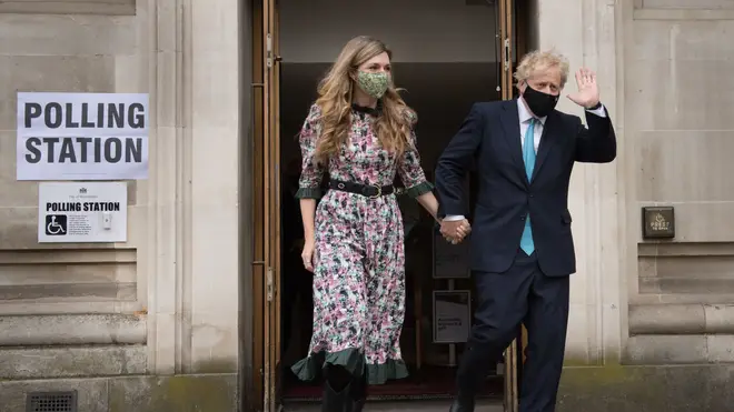 Boris Johnson and Carrie Symonds leave after casting their vote